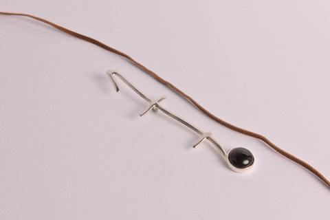 Pendant in sterling silver on leather thong necklace